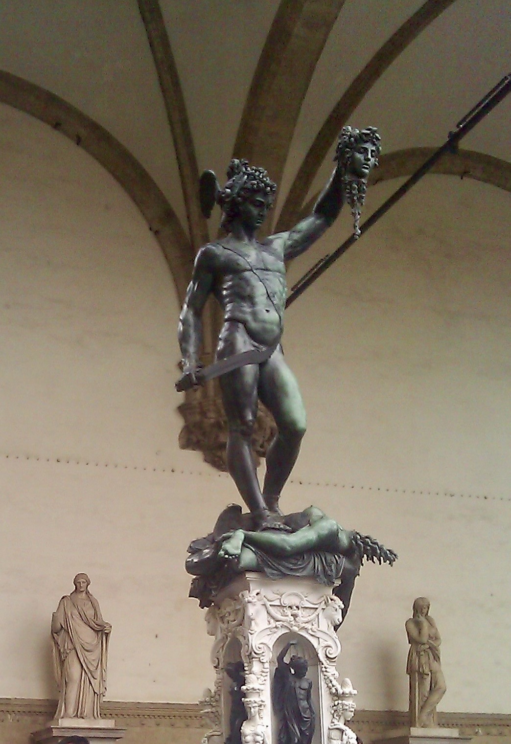 The bronze Perseus statue under the Loggia dei Lanzi on Piazza della Signoria in Florence, Italy