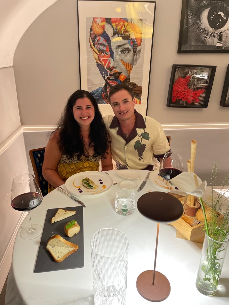 Couple at a candlelit anniversary dinner