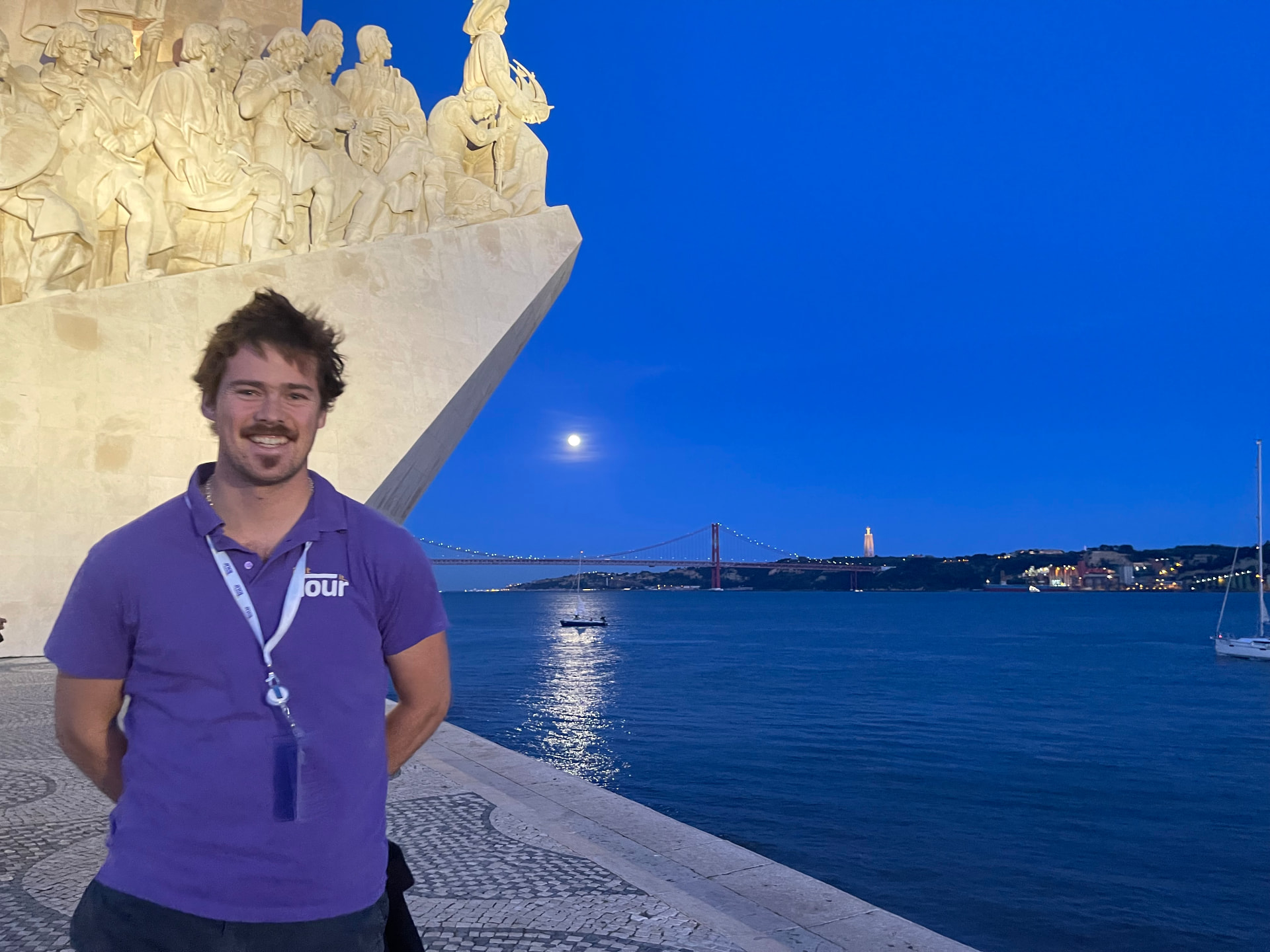 The Monument to the Discoveries on the Lisbon waterfront under a clear sky