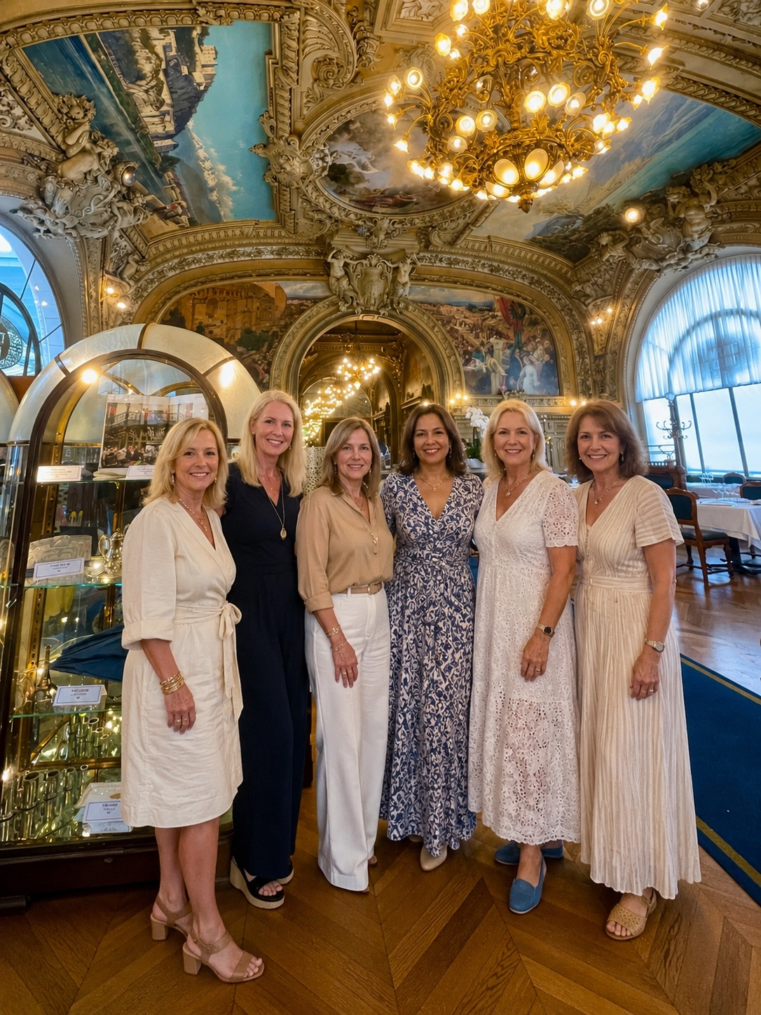 Women friends sharing Champagne during an elegant girls getaway in Paris