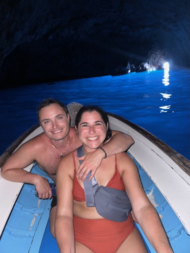 Couple on a boat inside the Blue Grotto, Capri