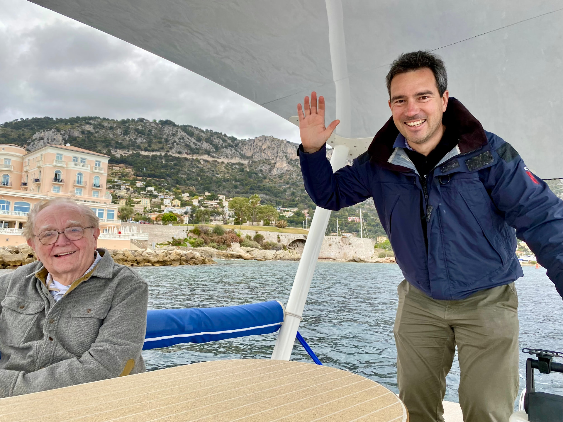 Small private boat anchored in the clear turquoise water of Villefranche-sur-Mer on the French Riviera