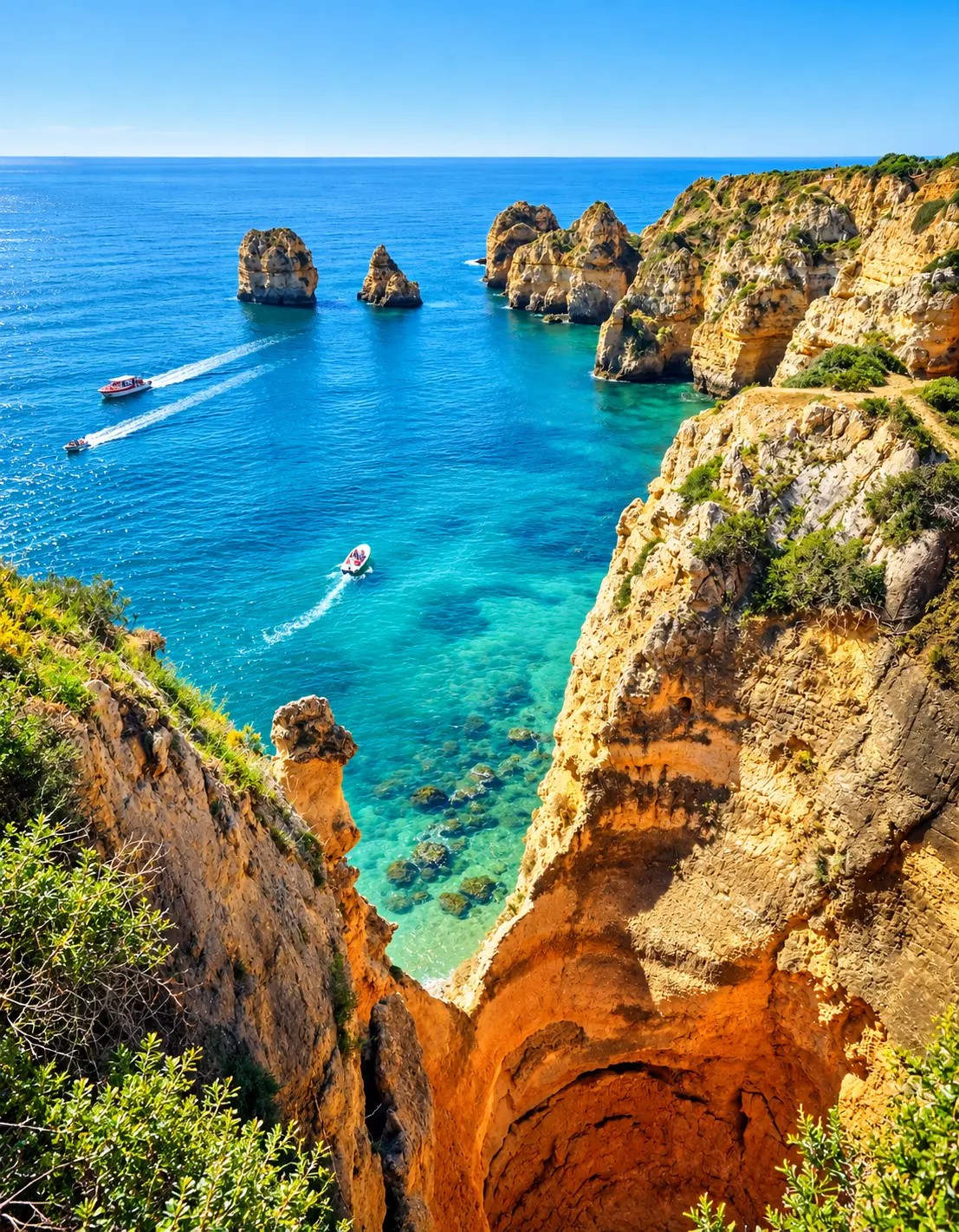 Golden cliffs curving around a sheltered cove on the Algarve coast