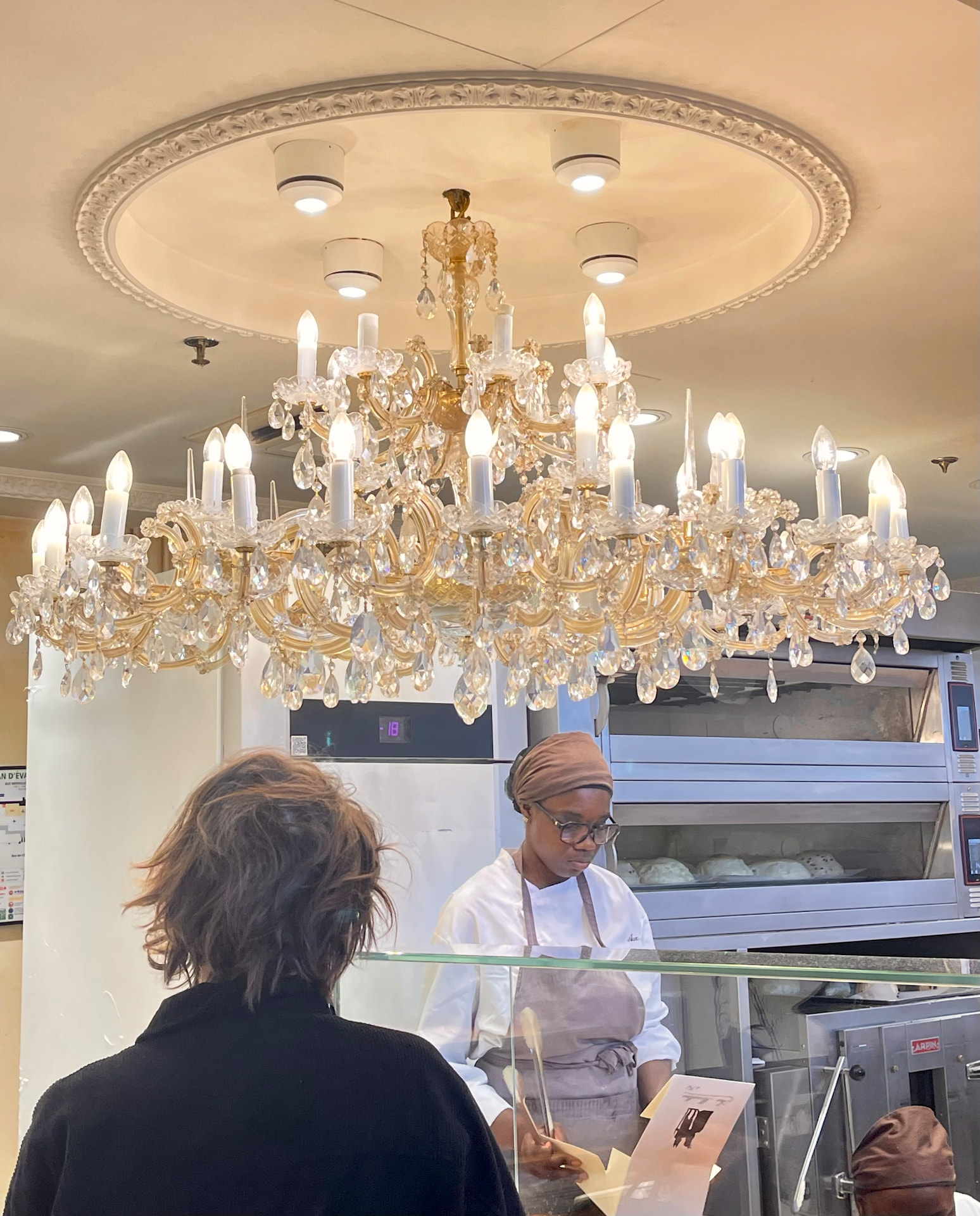 Crystal chandelier in a Paris pâtisserie