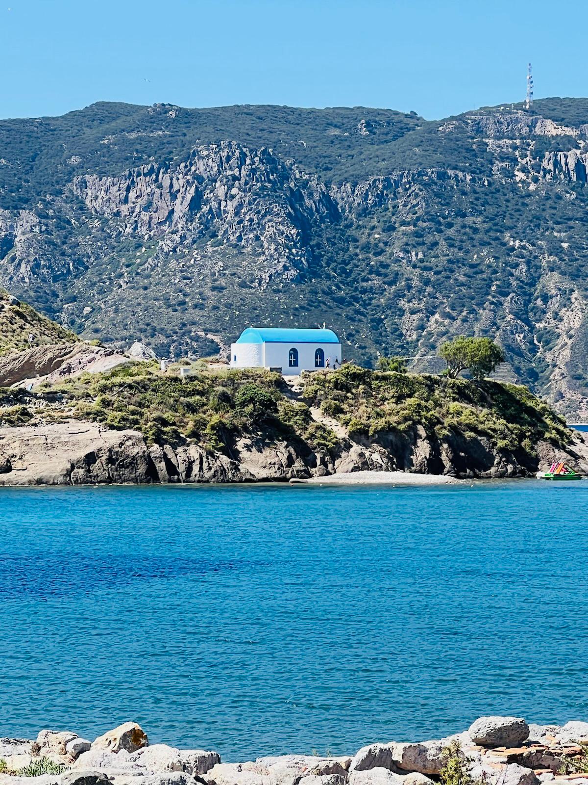Blue-domed chapel above a hidden cove