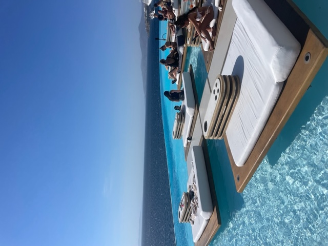 Floating daybeds in an infinity pool in Mykonos