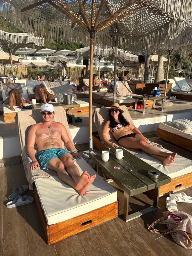 Couple relaxing at a Mediterranean beach club